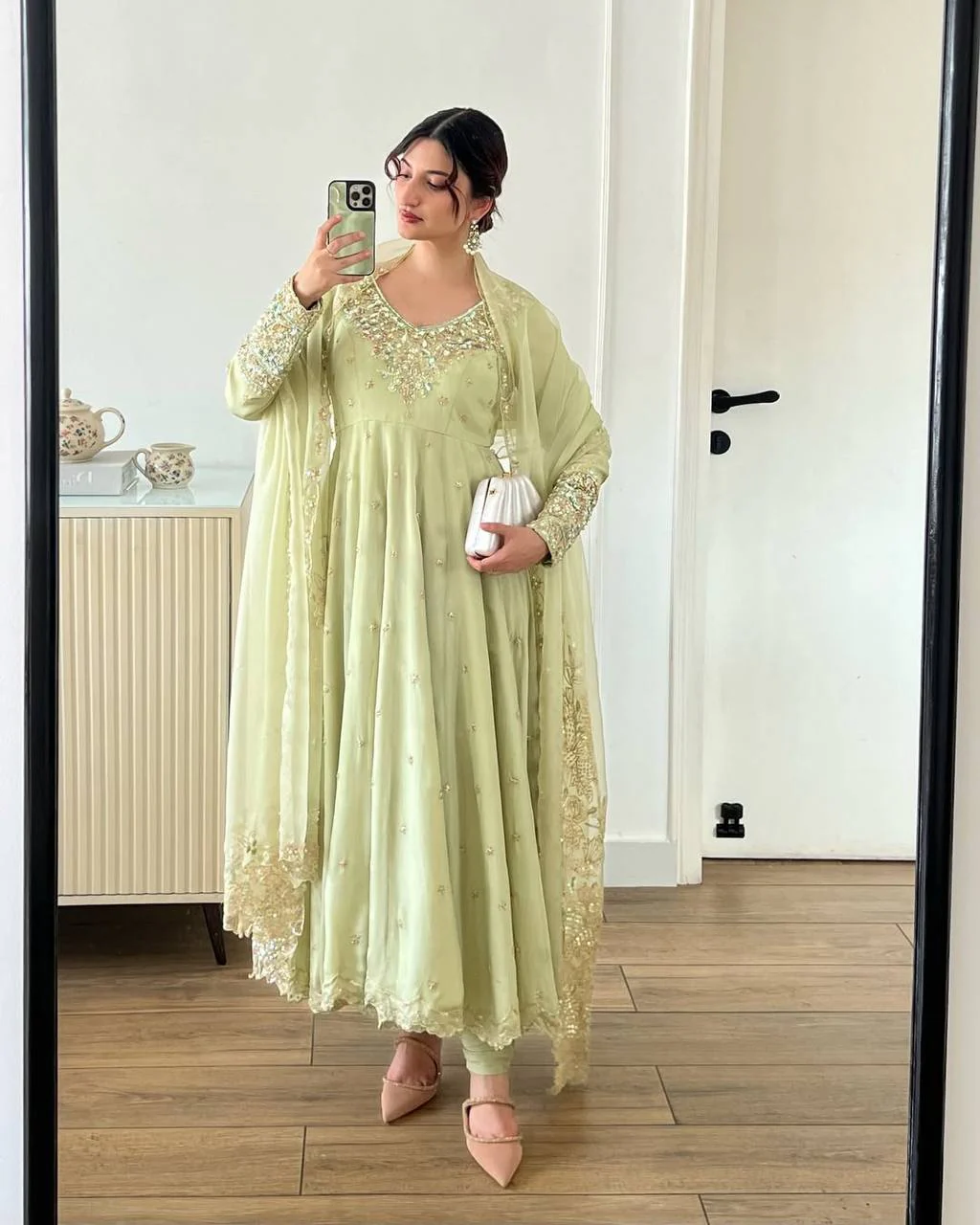 A Stylish Woman in a Green Dress - Image 7